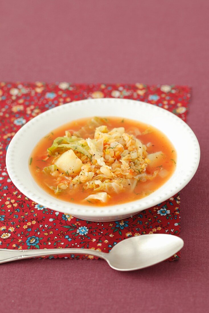 Savoy cabbage soup with potatoes, red lentils and tomatoes