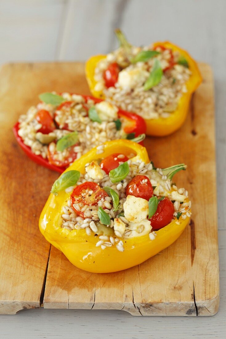 Stuffed peppers filled with barley, cherry tomatoes and feta cheese