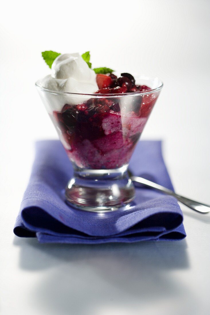 Apples and Berries with Whipped Cream in a Glass Dish