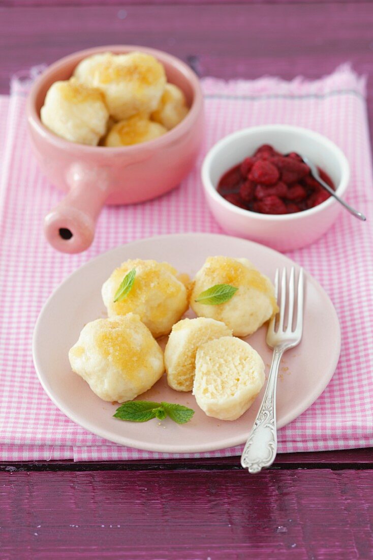 Quark dumplings with buttered crumbs and raspberry sauce