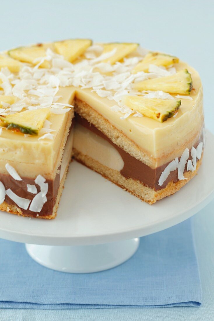 Banana, chocolate and pineapple mousse cake with pineapple and coconut