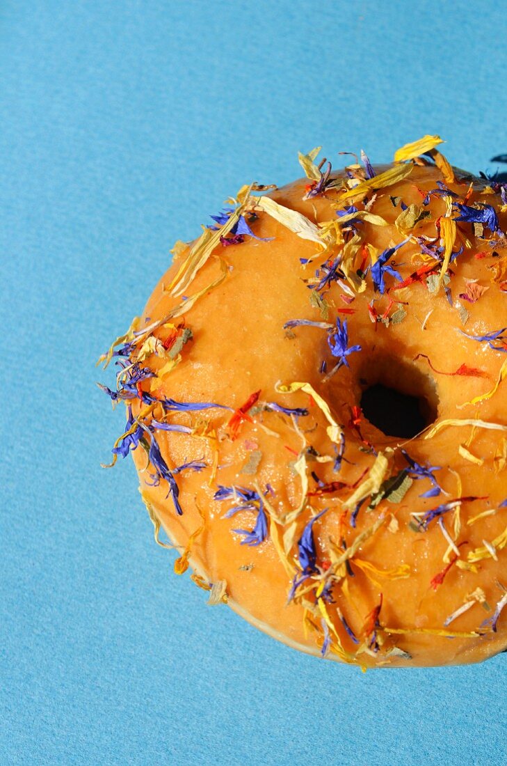 A doughnut decorated with petals