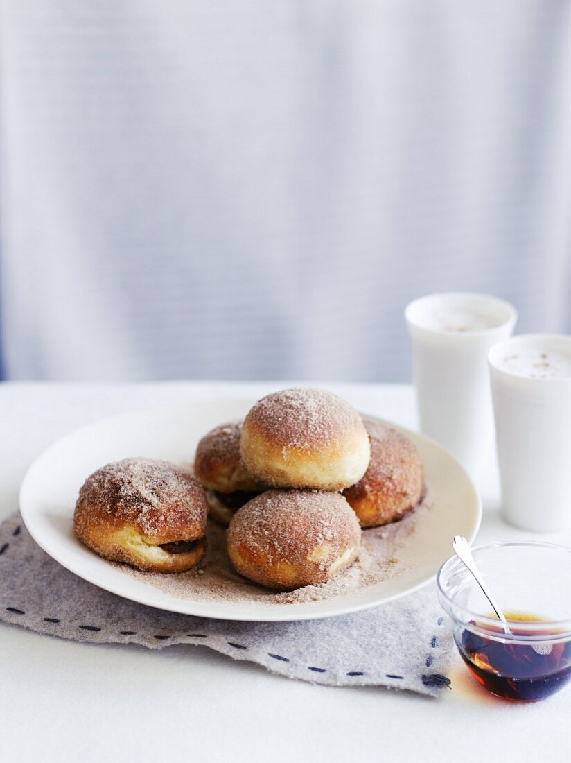 Doughnuts with jam and sugar