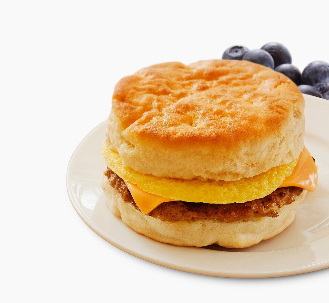 Sausage Egg and Cheese Breakfast Sandwich on a Biscuit; White Background
