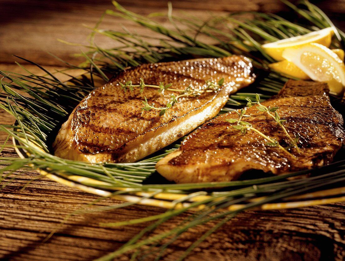 Grilled Trout on Sea Grass; Lemon Wedges