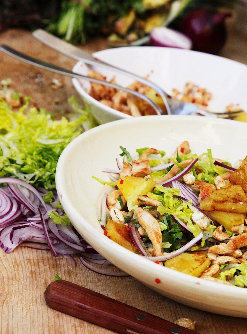 Pineapple salad with chicken and red onions