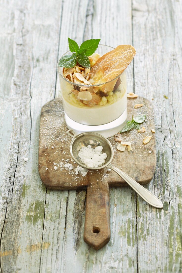 Apple strudel with vanilla sauce in a glass