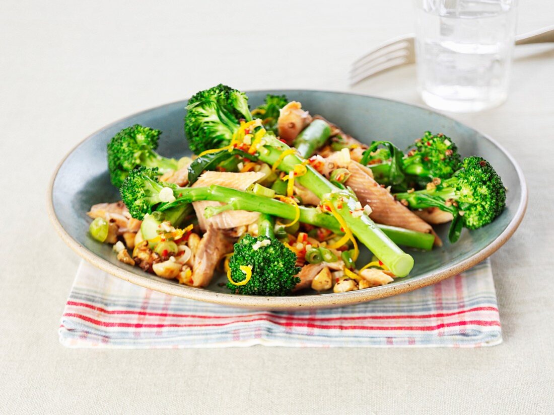 Smoked salmon trout with broccoli, nuts and orange zest