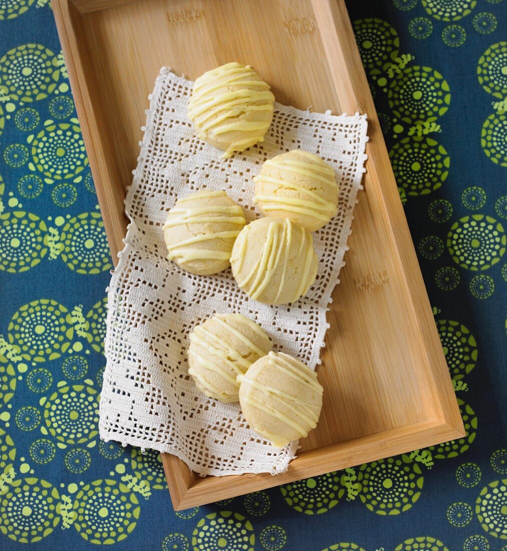 Lemon Tea Cookies on a Doily on a Wooden Tray