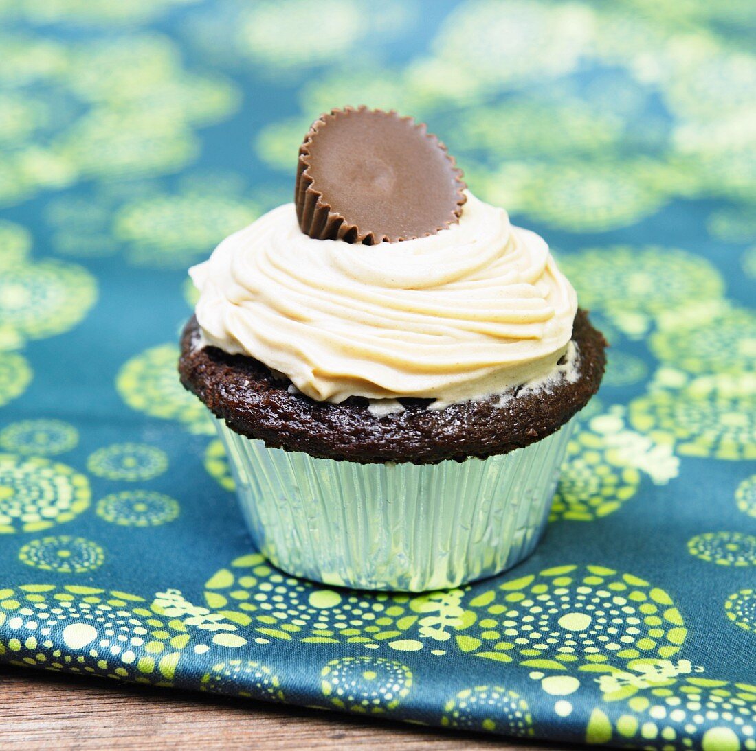 Chocolate Cupcake with Peanut Butter Frosting and a Peanut Butter Filled Chocolate Candy on Top