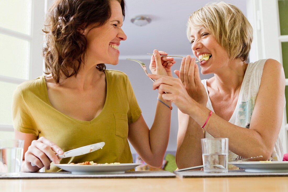 Two women eating together