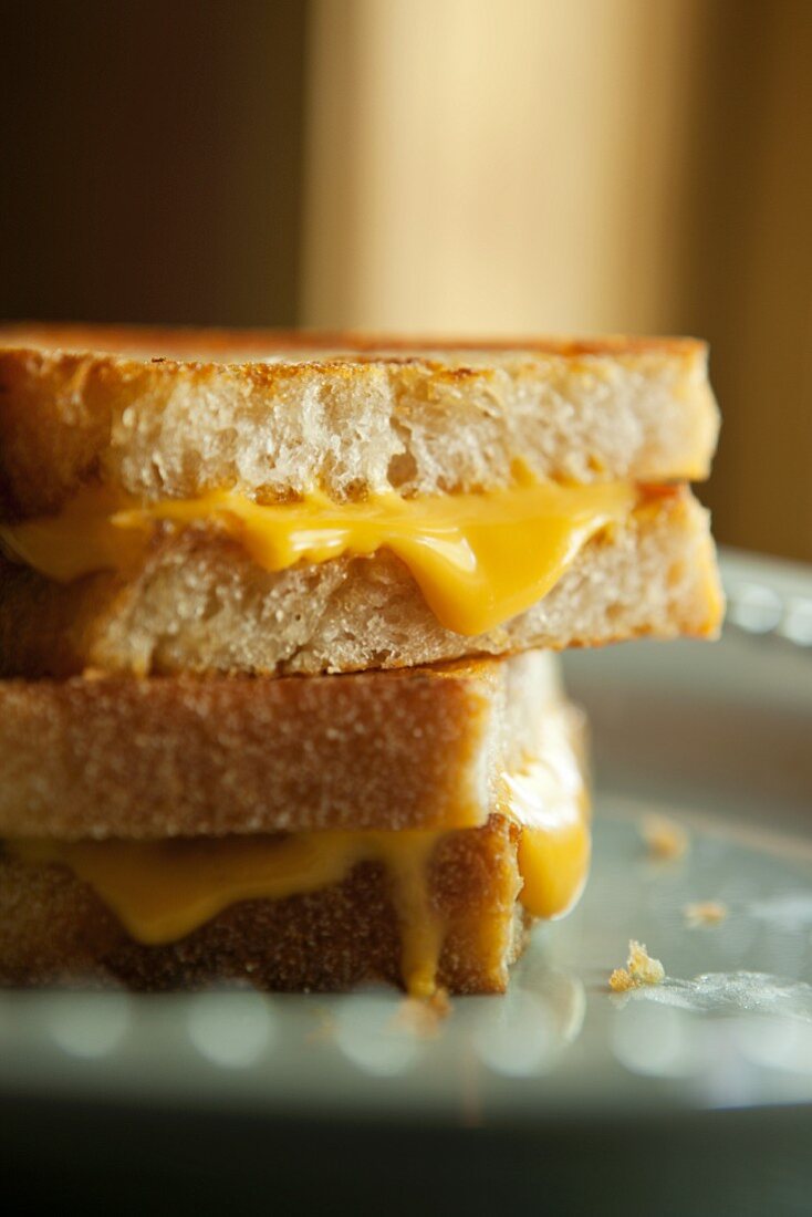 Grilled Cheese Sandwich on Crusty White Bread; Halved and Stacked
