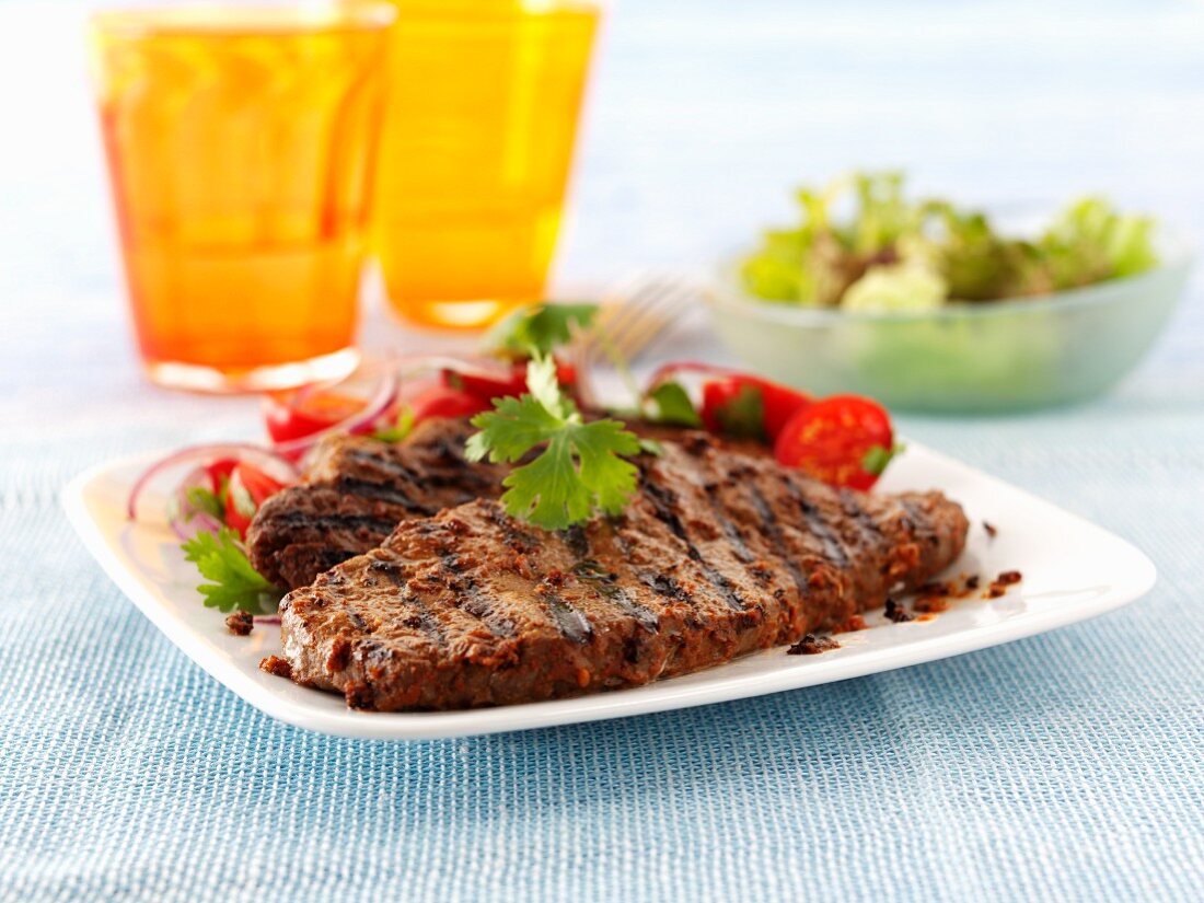 Grilled steak with tomato salad