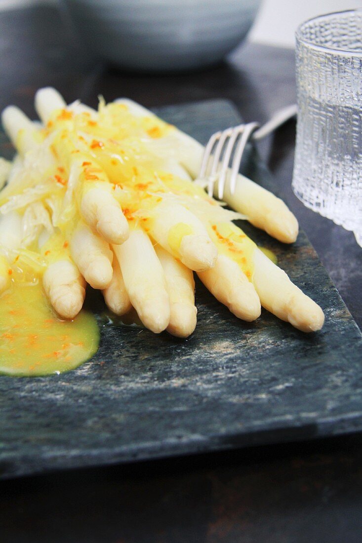 Asparagus with turmeric butter sauce and pomelo