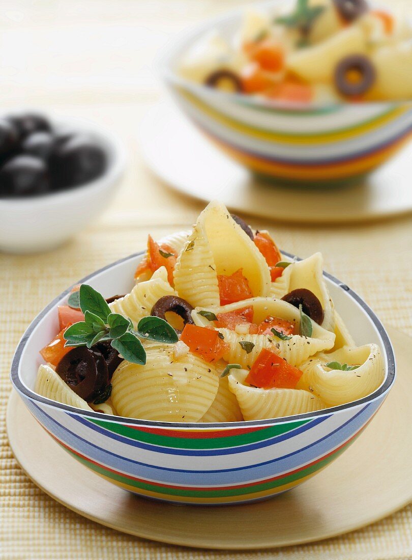 Conchiglie pasta with olives and tomatoes