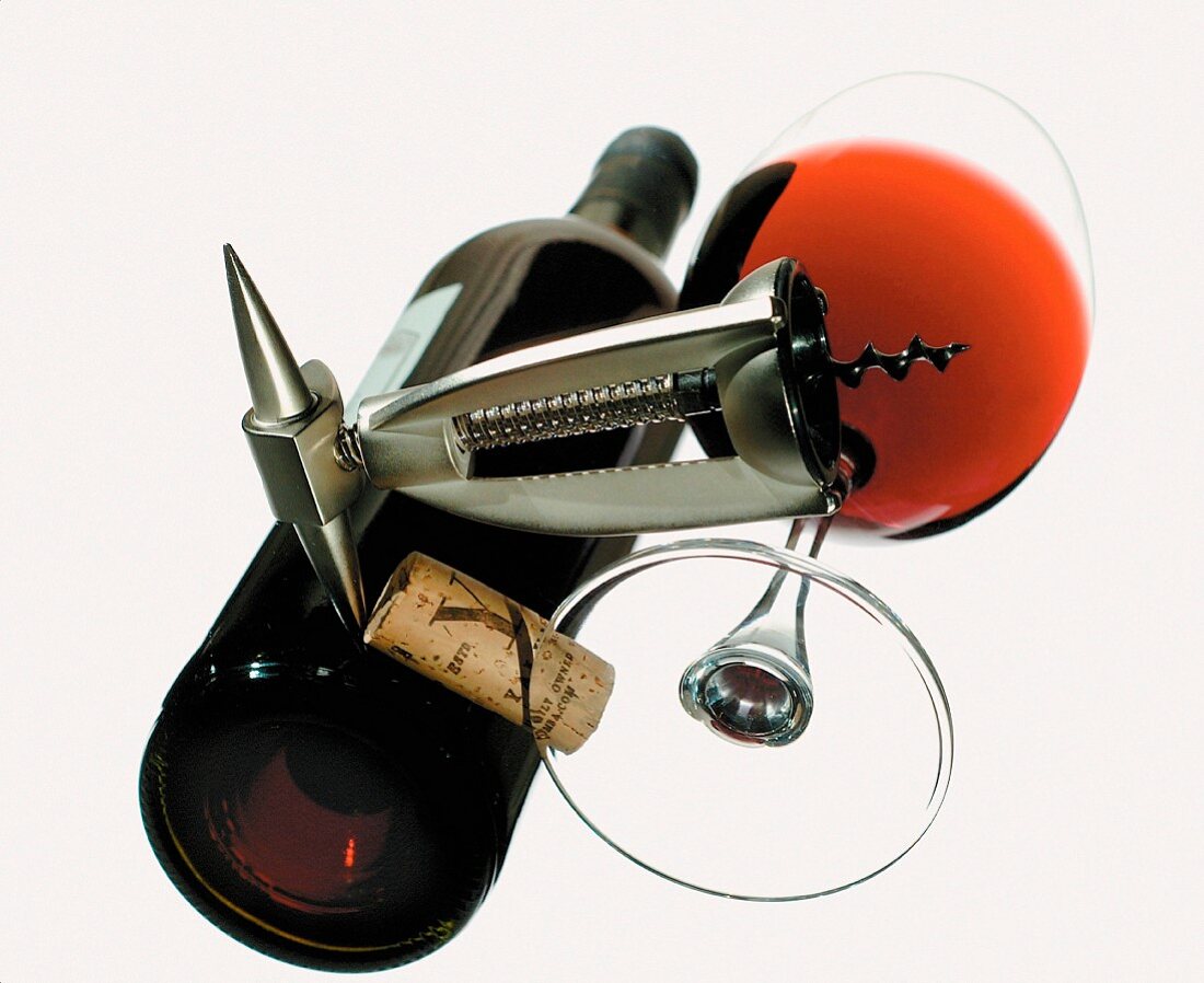 Wine bottle, wine glass and corkscrew