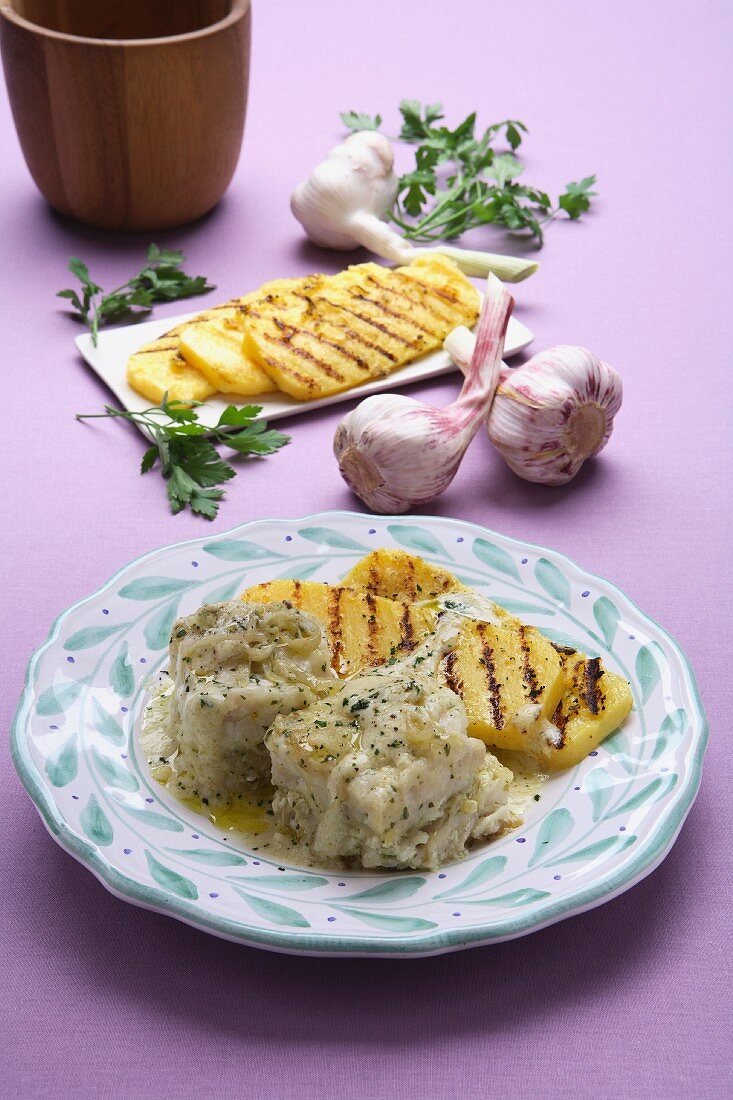 Baccala alla vicentina with polenta (stockfish from Vicenza, Italy)