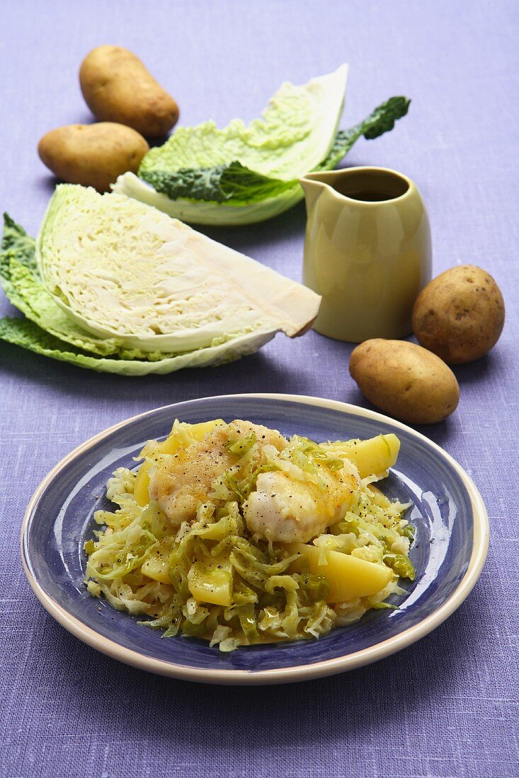 Savoy cabbage with fish and potatoes