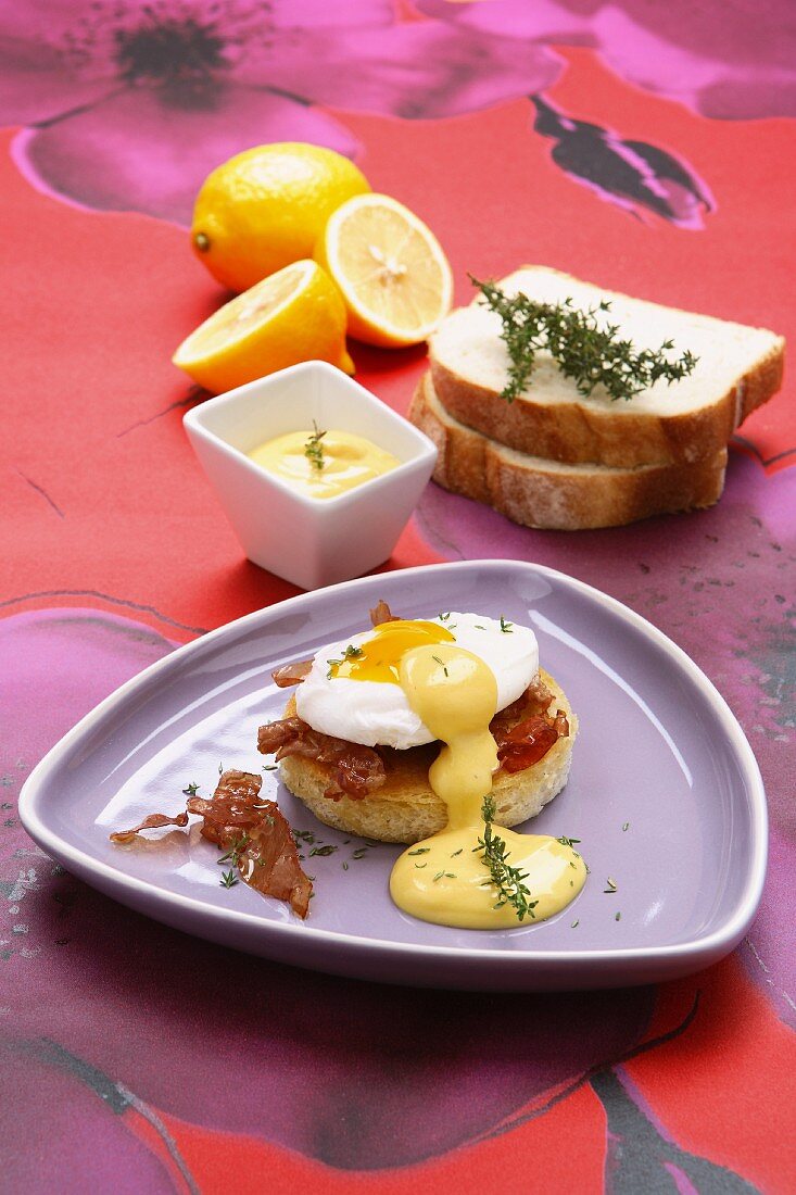 Eggs Benedict with bacon and sauce Hollandaise