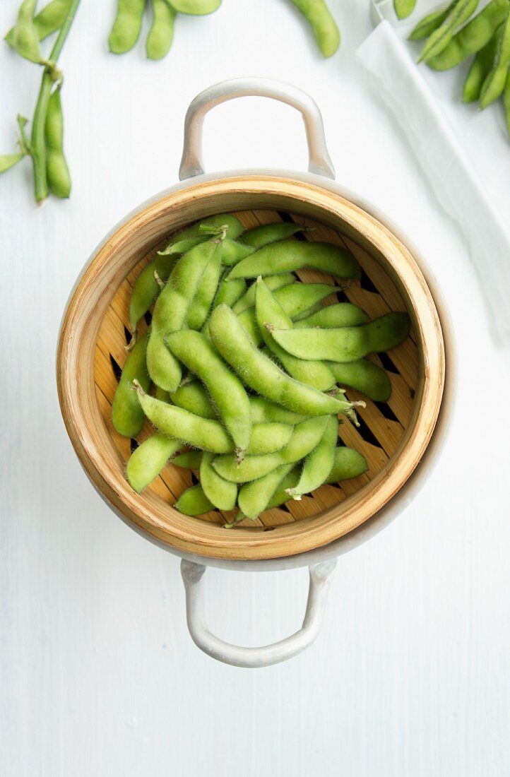 Soy beans in a bamboo steamer