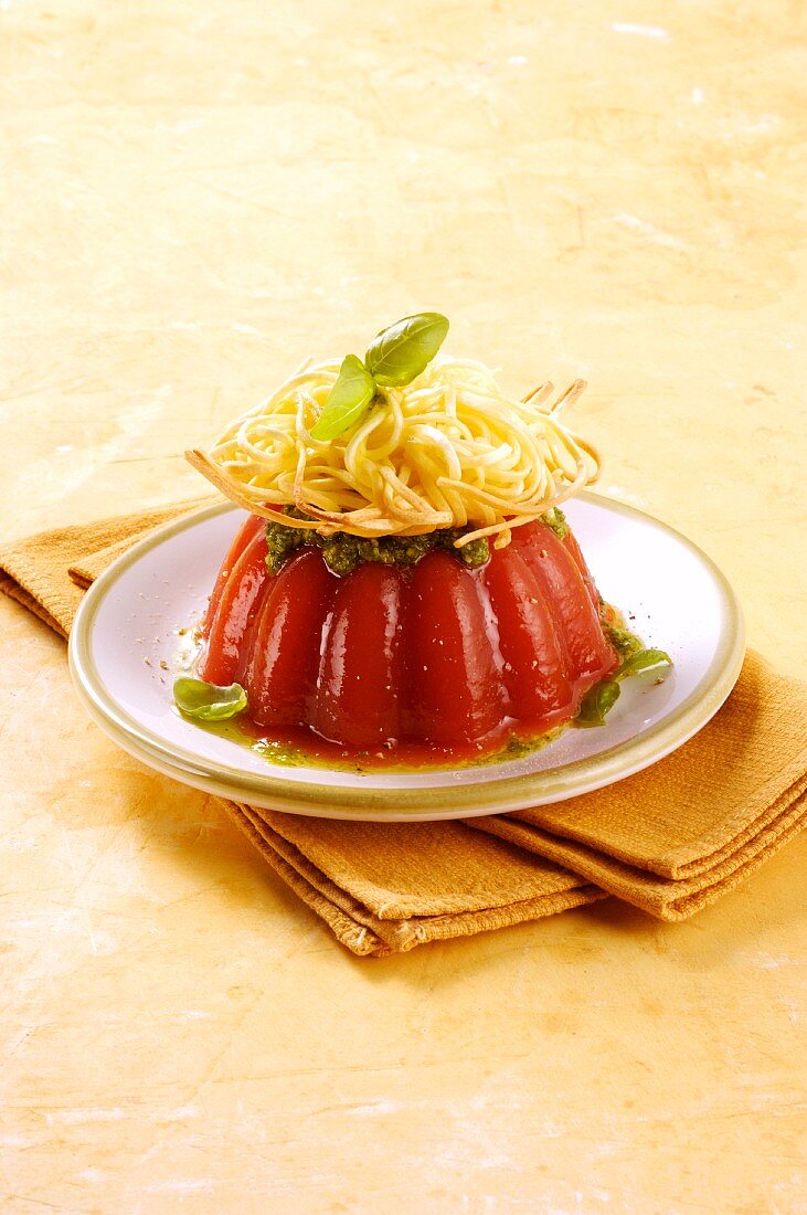 Tagliolini with pesto on tomato jelly