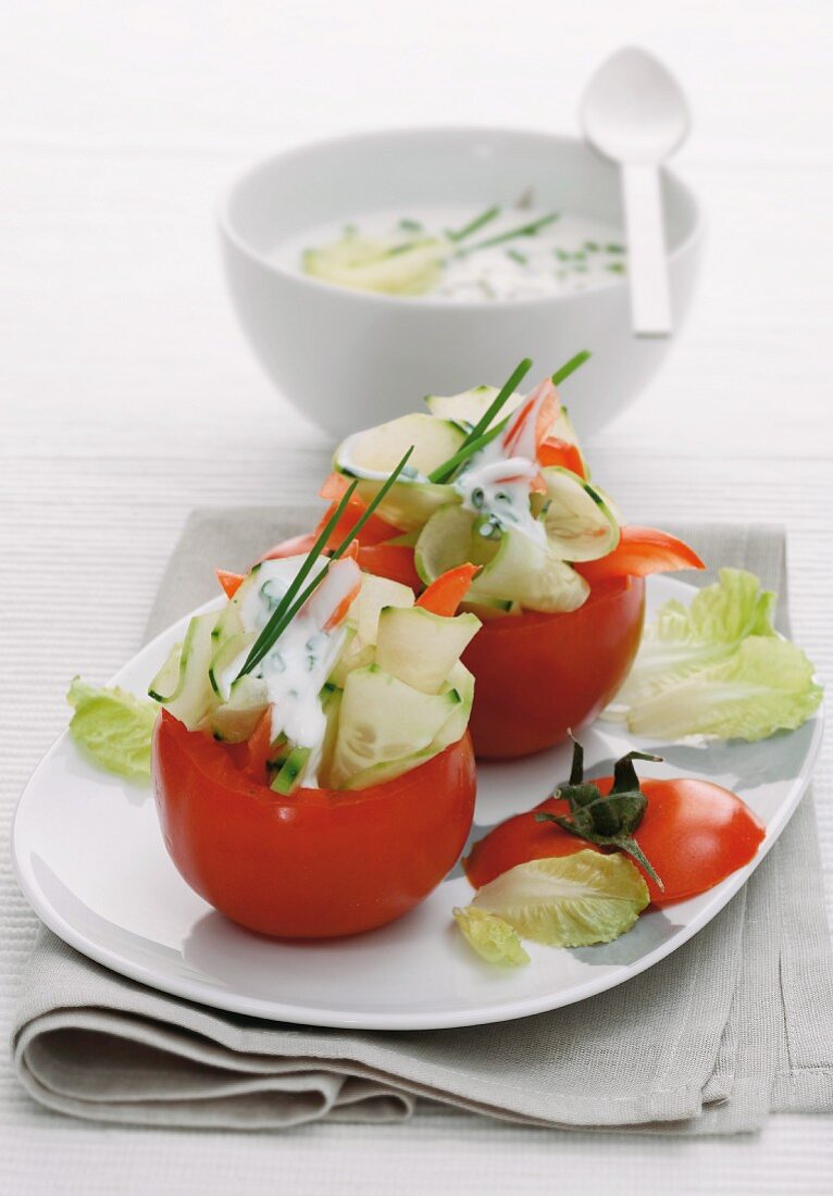 Stuffed tomatoes with cucumber and a chive sauce