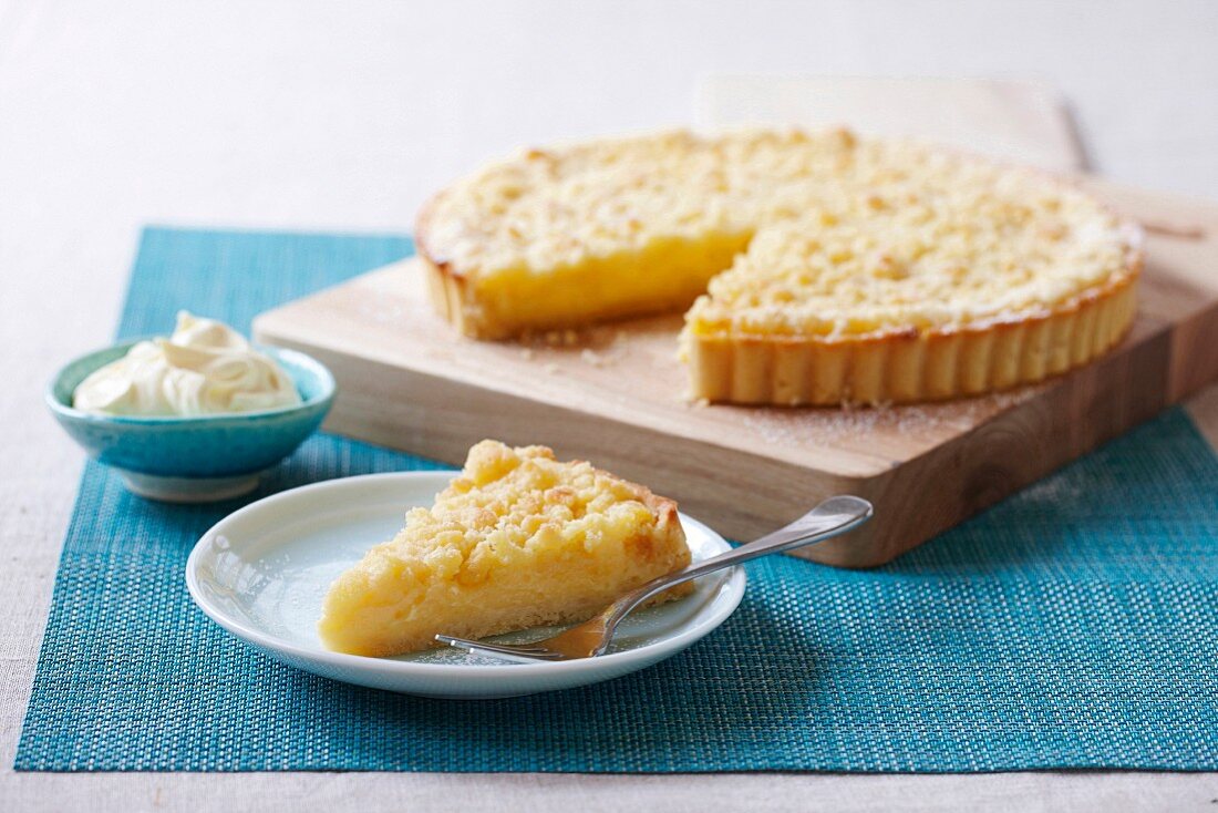 Lemon crumble tart with one slice cut