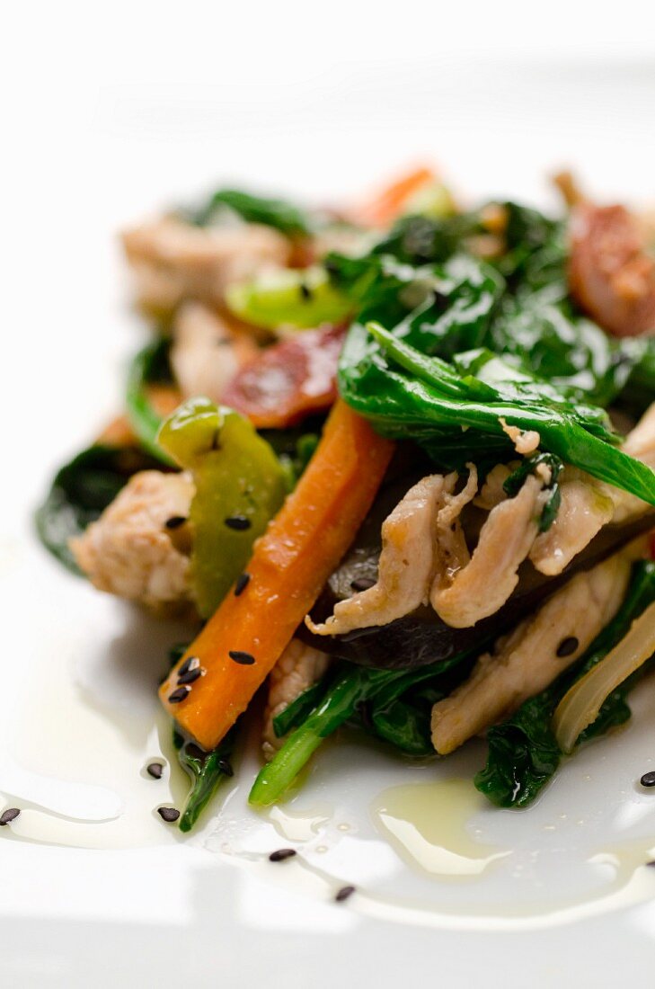 Stir-fried vegetables with chicken breast and sesame seeds