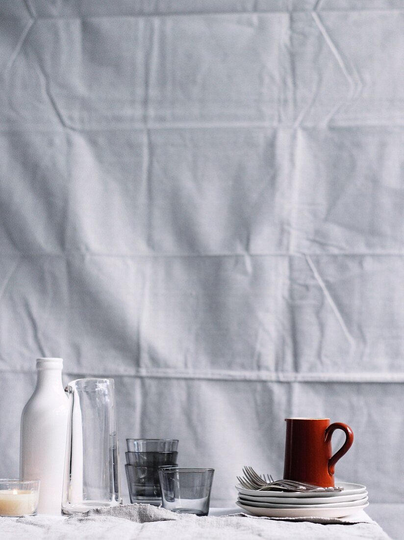 Glasses, crockery and cutlery on a table