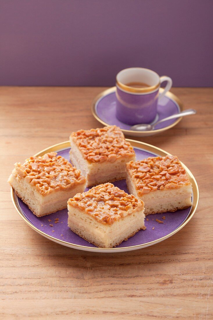Four pieces of bee sting cake on a purple plate