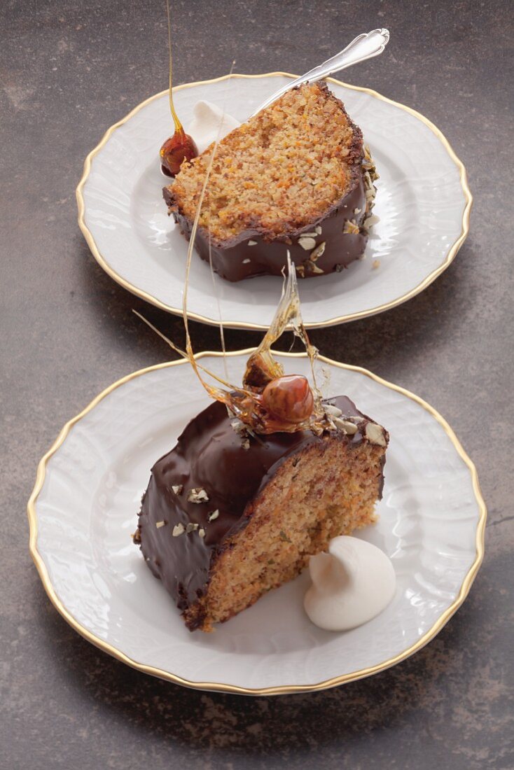 Two pieces of hazelnut and courgette cake on plates