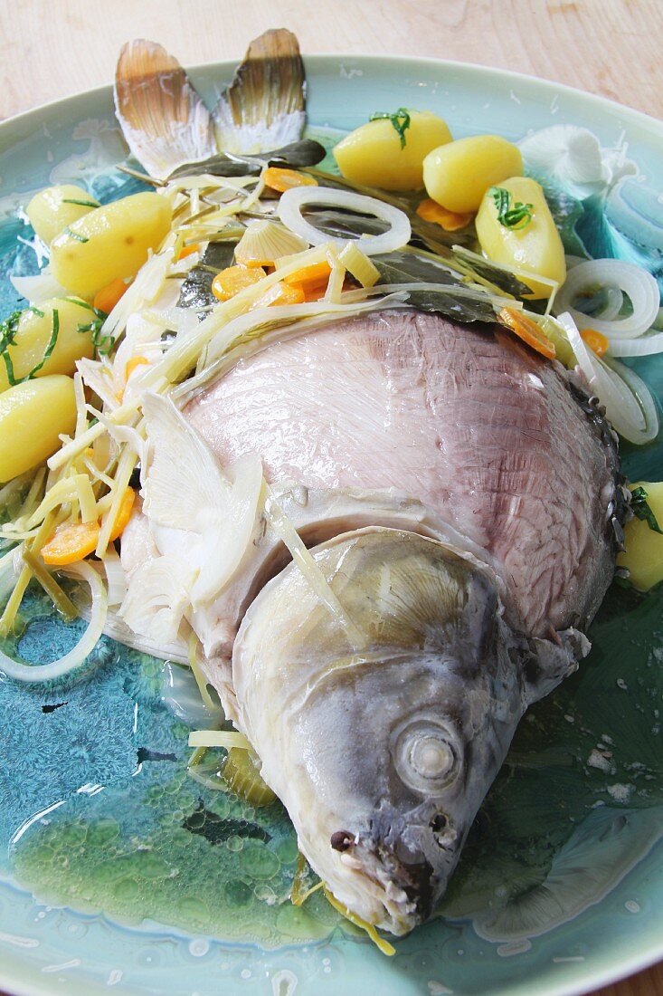 Blue carp with potatoes and vegetables