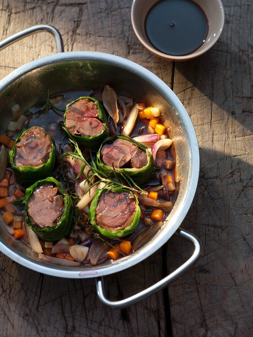 Braised venison leg wrapped in cabbage