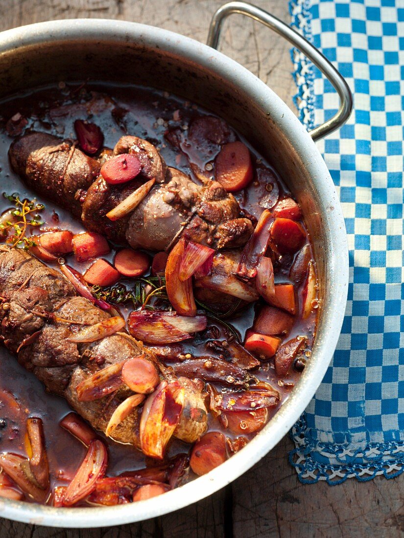 Venison shoulder with carrots and onions