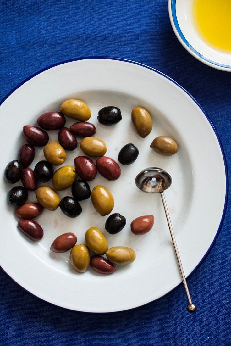 Olives on a plate with olive oil