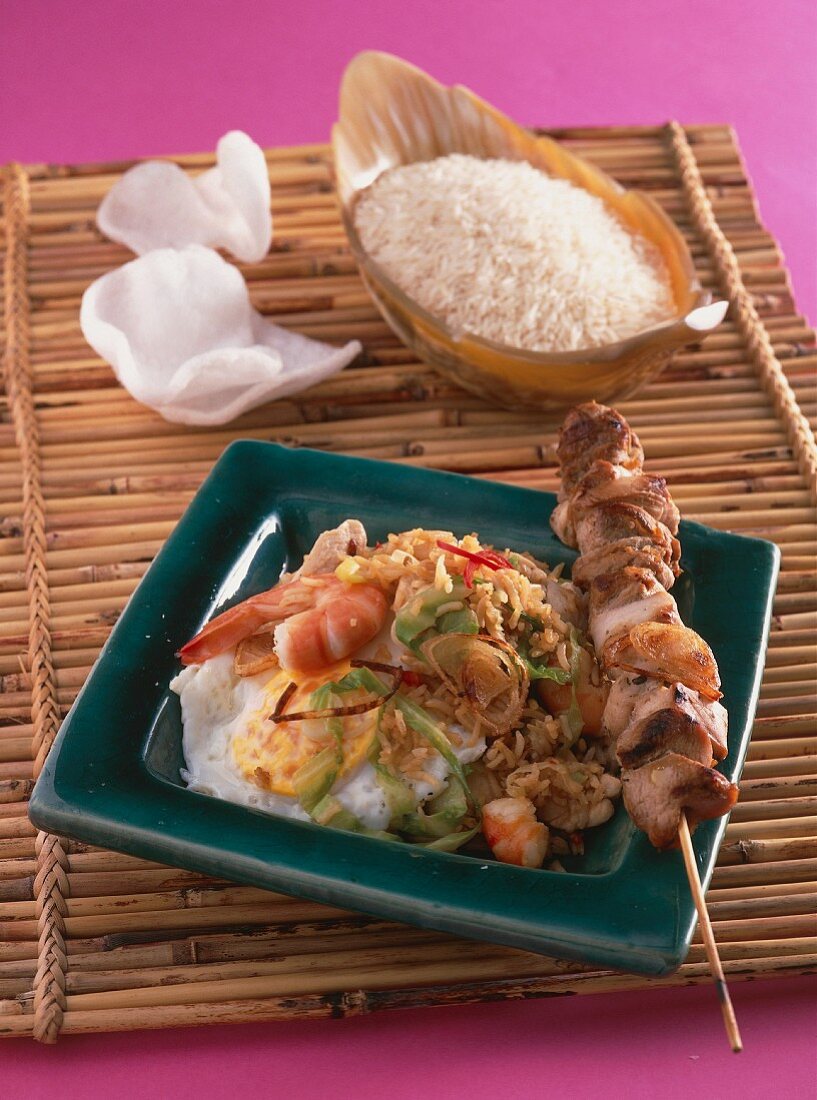 Nasi goreng with meat kebabs and prawns (Indonesia)