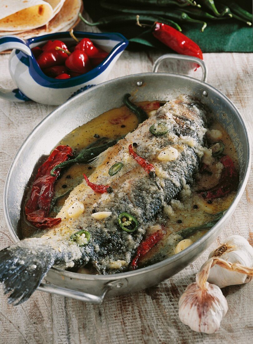 Sea bass with garlic and chilli peppers