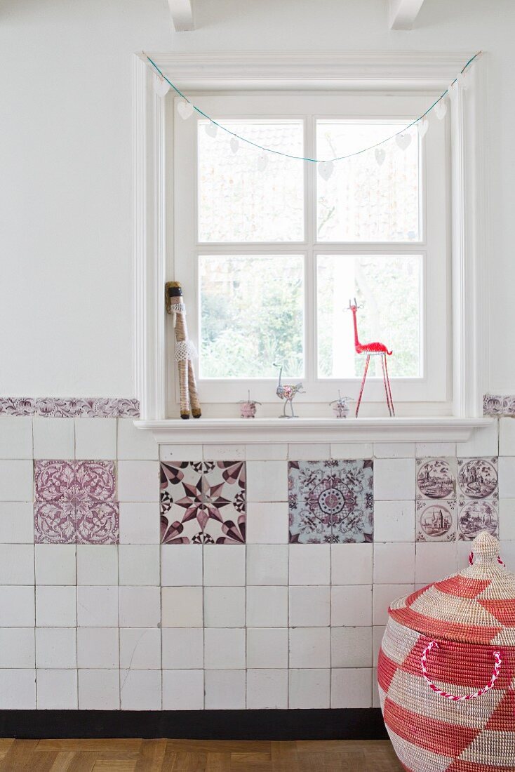 Traditional hand-made tiles below lattice window