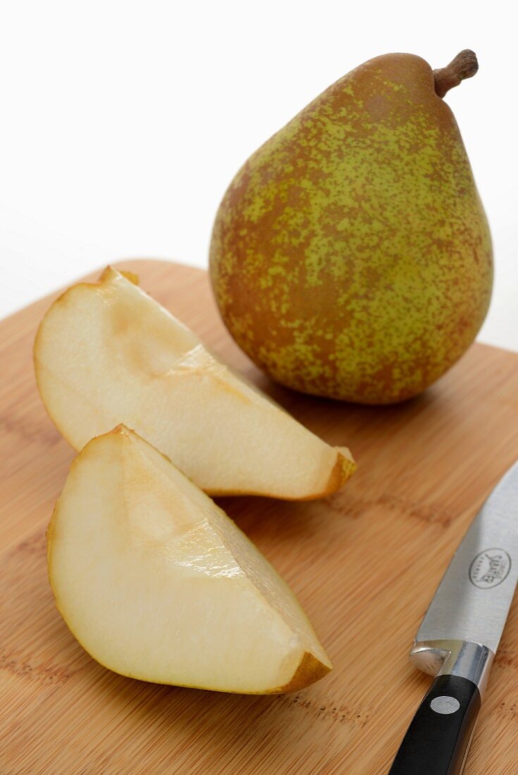Comice pear, whole and sliced