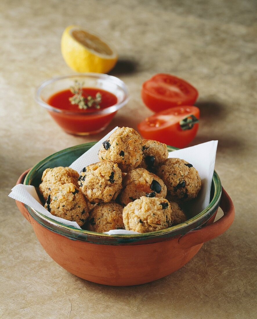 Olive dumplings with tomato sauce