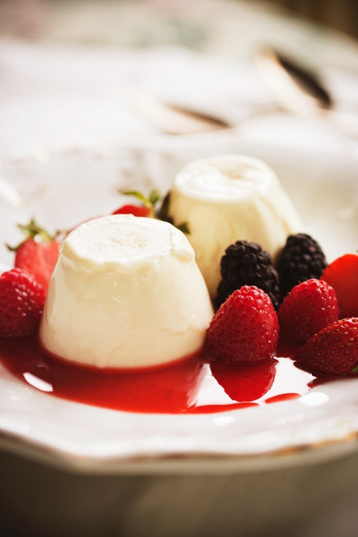 Panna Cotta with Berry Sauce and Fresh Berries