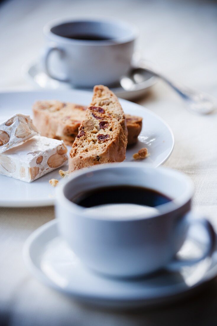 Cups of Espresso with Biscotti and Almond Nougat