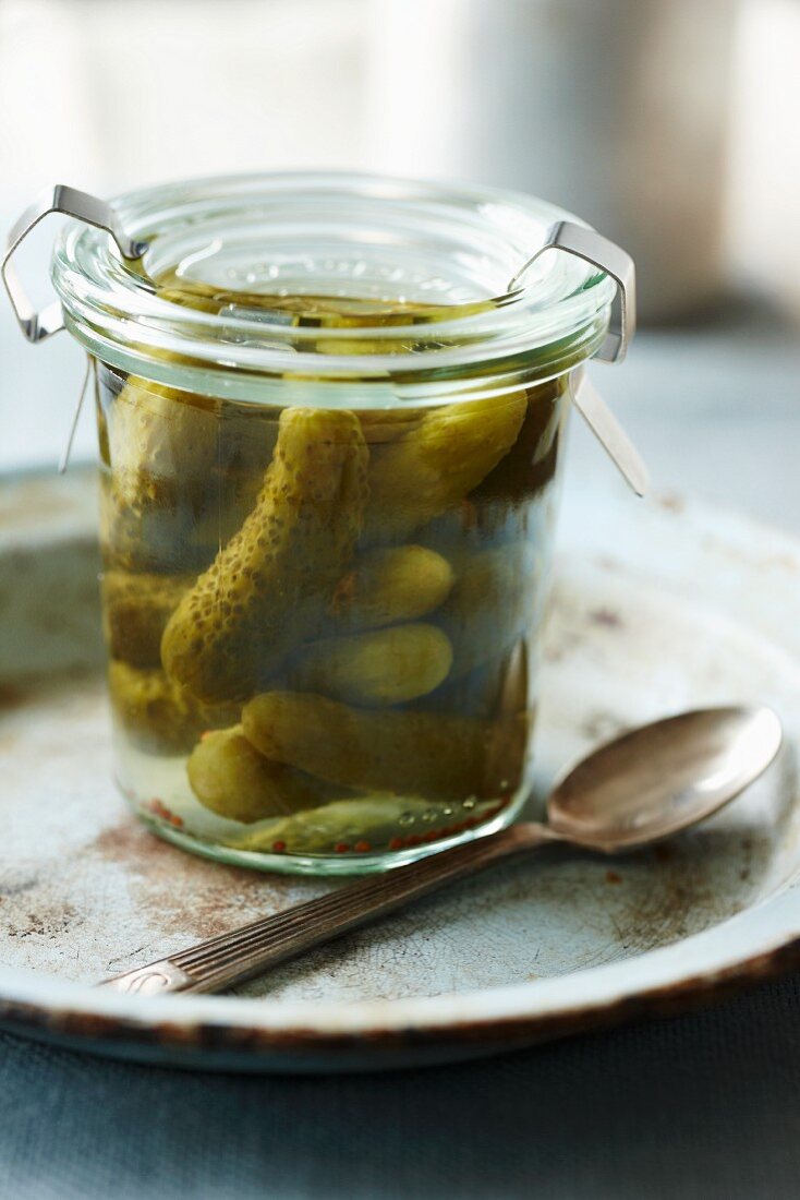 Pickled gherkins in a preserving jar