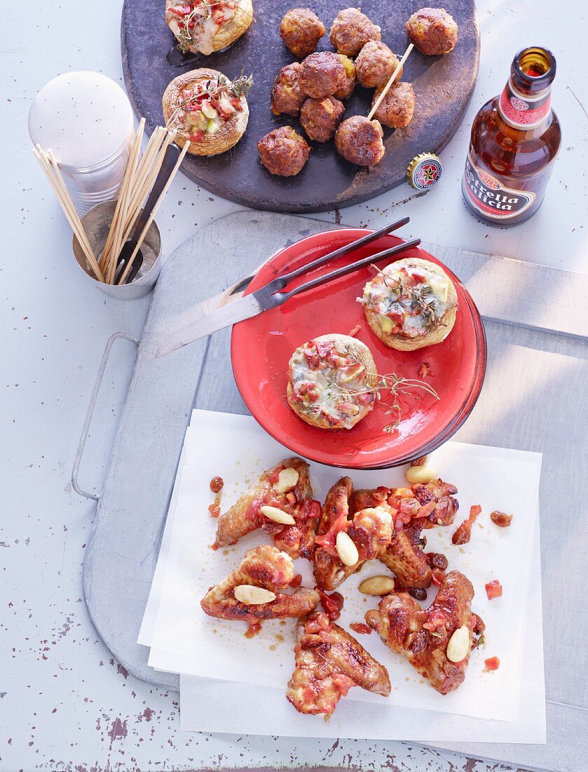 Mushrooms with figs and chorizo, chicken wings in sherry and minced meat and apricot balls