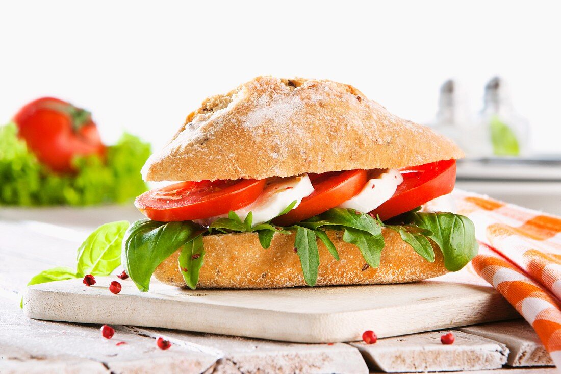 A tomato, mozzarella and basil sandwich