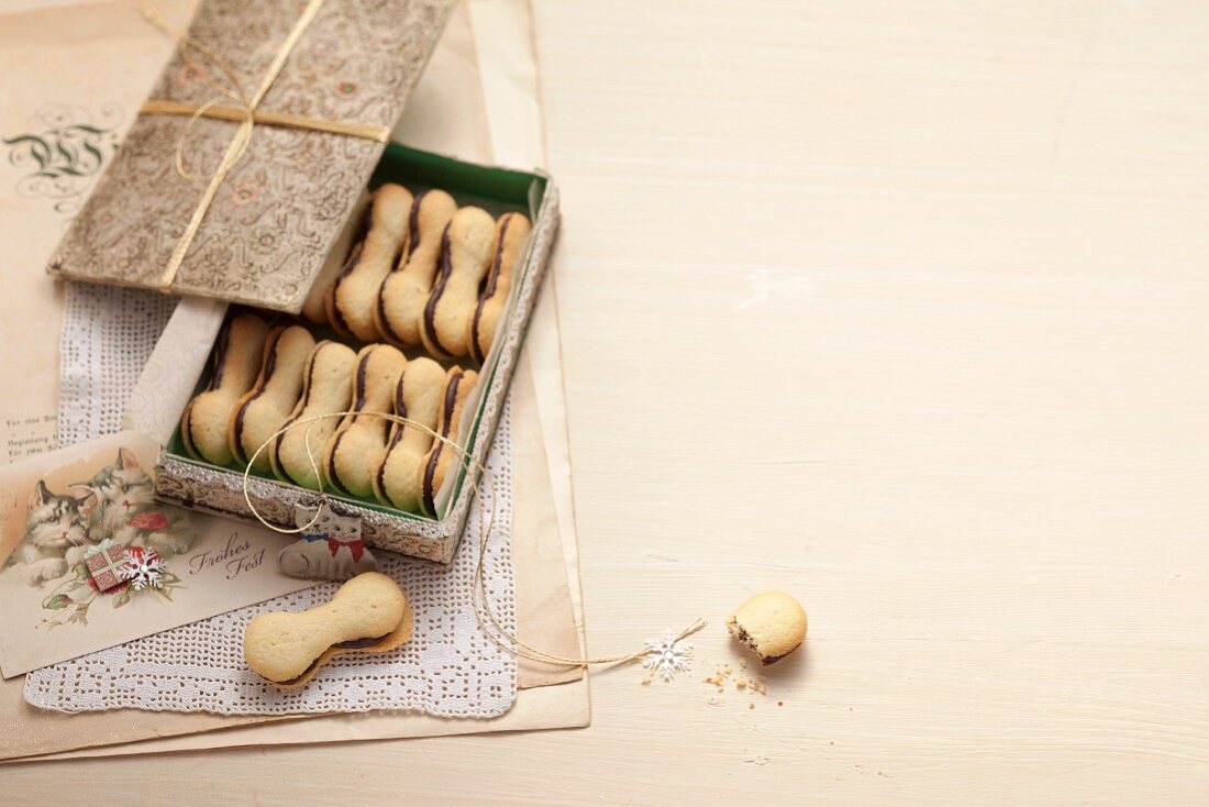 Chocolate cat tongues filled with almond cream as a gift