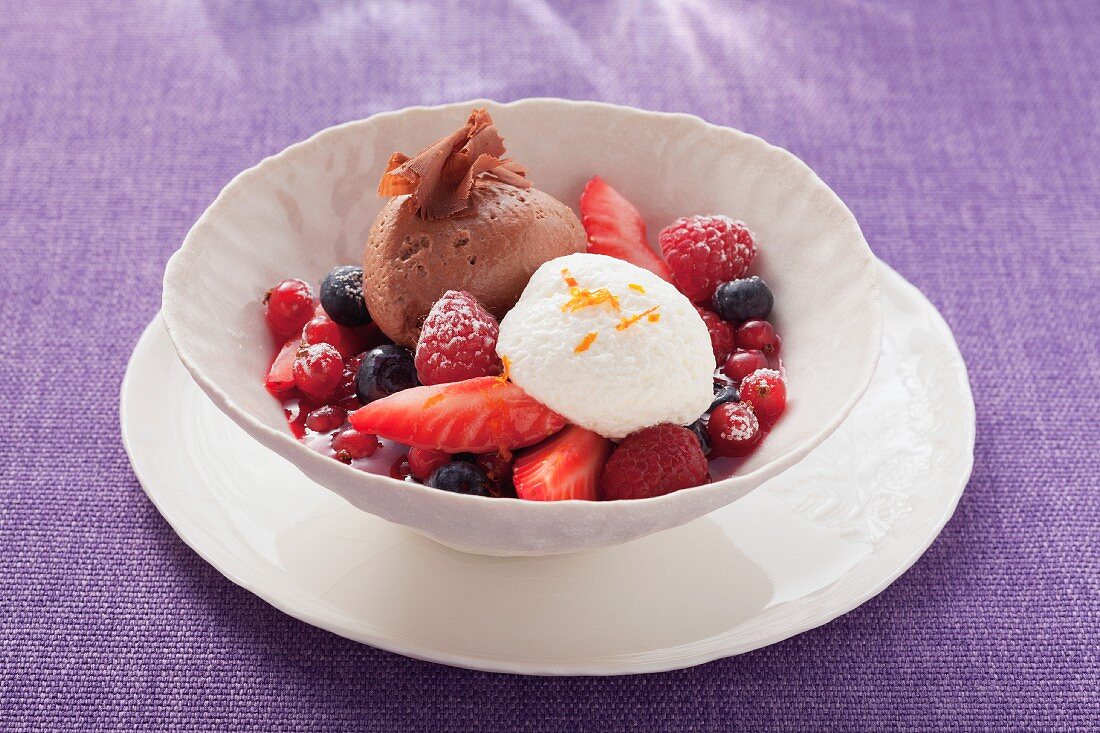 Light and dark mousse au chocolat with berries