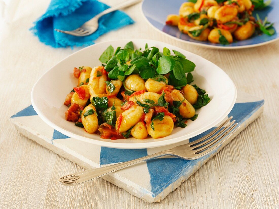 Gnocchi with tomatoes and watercress