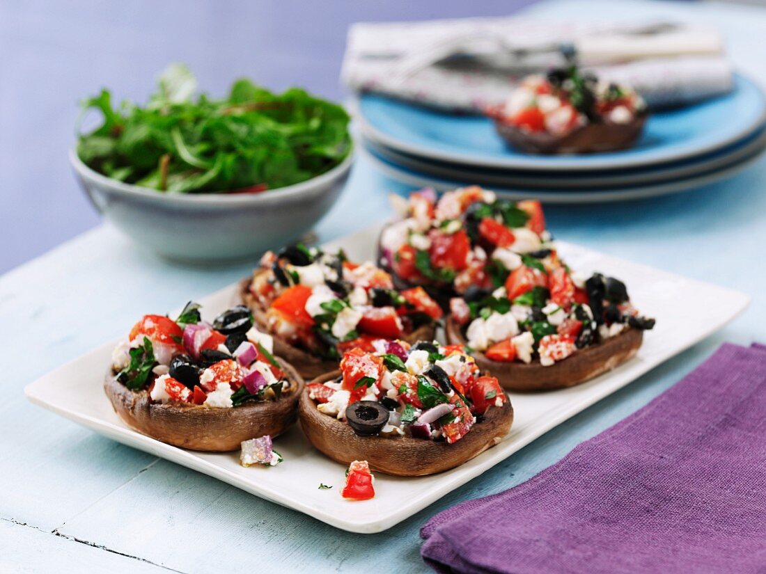 Mushrooms filled with olives, tomatoes and feta