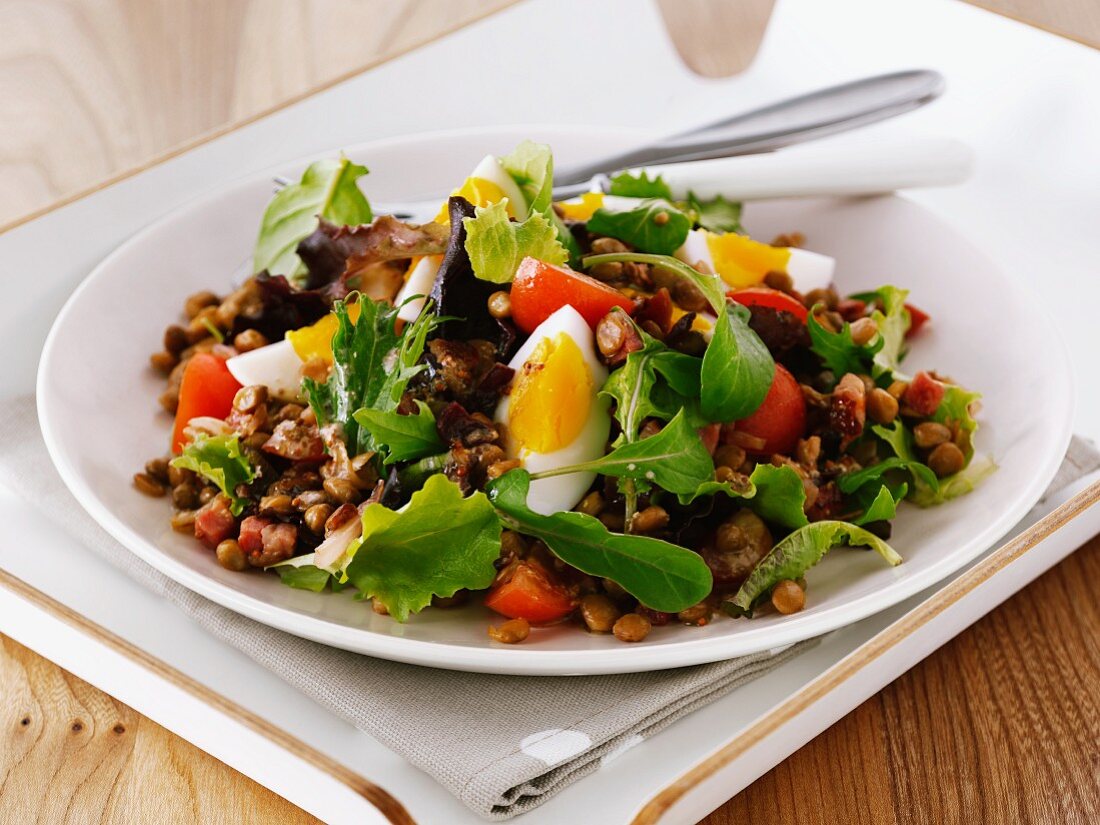 Lentil and chickpea salad with tomatoes and egg